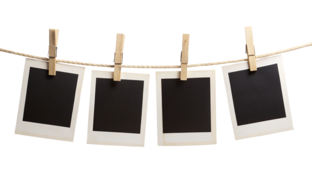 Four blank instant photo frames hanging on a rope