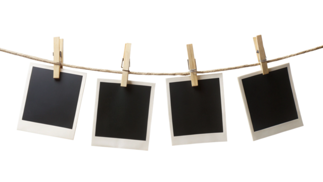 Four blank instant photo frames hanging on a rope
