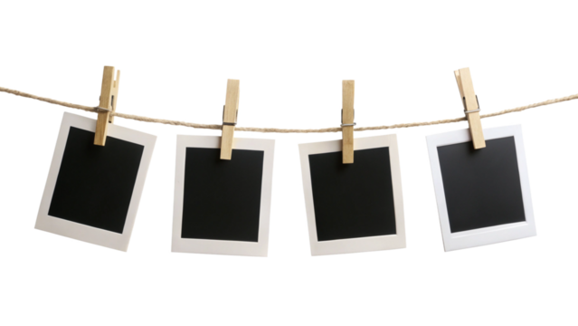Four blank instant photo frames hanging on a rope