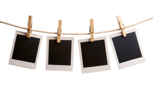 Four blank instant photo frames hanging on a rope