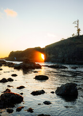 Scenic view of Second Beach at sunset in Olympic National Park, Washington State. Dramatic sea stacks, golden sky, and peaceful waves along the rugged Pacific Northwest coast.