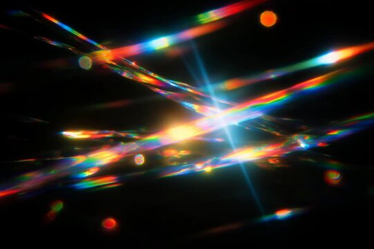 Dark abstract scene with scattered rainbow light refractions and irregular chromatic fragments. Central halo of white glow is surrounded by color fringes, resembling prism glass scattering.