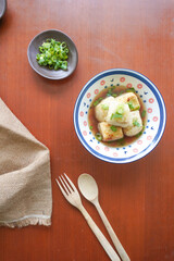 Agedashi Tofu is a spicy fried tofu dish from Japan. Silken tofu or silken bean curd, kinugoshi, is diced and then sprinkled with potato starch or cornstarch.