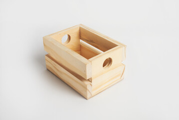 Empty wooden crate resting on white background