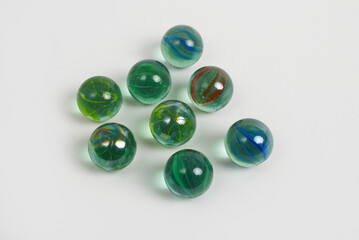 Group of colorful glass marbles on white background