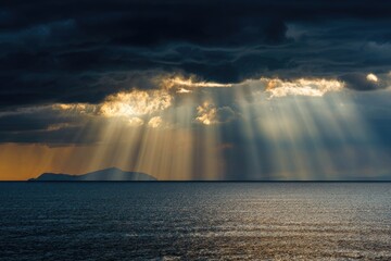 Dramatic sunset or sunrise over a calm ocean with dramatic clouds