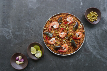 Paella is a Spanish dish made from rice, seafood, shrimp, clams,