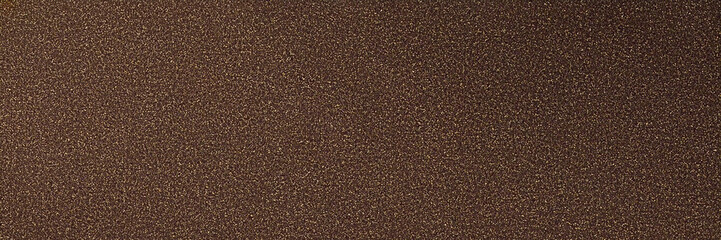 Fototapeta premium Brown grainy texture. Surface shows subtle shadows, creating depth. Suitable for branding, product display, or as a backdrop for social media.