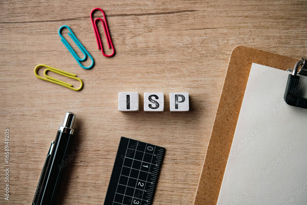 Aufkleber there is wood cube with the word isp. it is an abbreviation for internet service provider as eye-cat