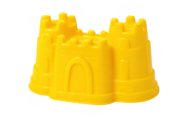 Yellow plastic sandcastle mold on transparent background representing summer fun