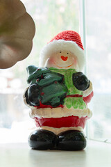 a cute Christmas snowman toy at vertical composition