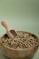 Green lentil copy space. Whole spelt grain species. High protein fiber-rich vegan plant based food ingredient. Gluten free superfood healthy nutritional dietary alternative food 