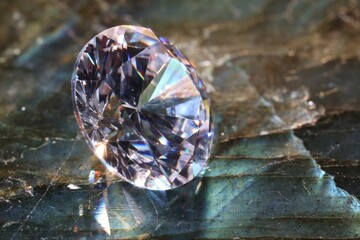 One shiny diamond on textured surface, macro view