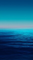 Obraz premium Minimal deep blue gradient fading into soft aqua calming water inspired vertical background