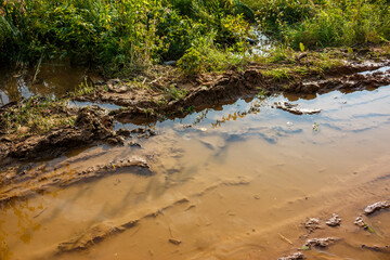 Puddle and mud on a country road