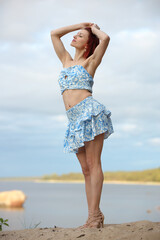 Naklejka premium Joyful Woman Posing by the Sea in Summer
