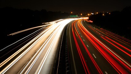 Streaking lights on a highway at night create a vibrant, dynamic sense of speed and motion.