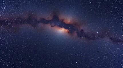 A starry night sky features a bright colorful Milky Way band stretching across the frame amidst countless stars