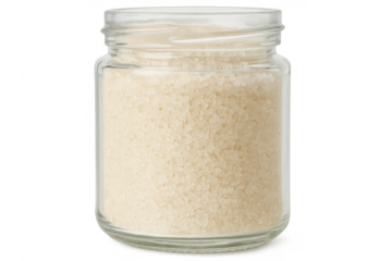 Glass jar filled with granulated white sugar on transparent background