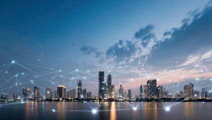 Obraz premium Panoramic view of a modern city skyline at dusk with illuminated skyscrapers reflecting on calm water, dramatic cloud formations overhead, and vibrant sunset colors in the sky