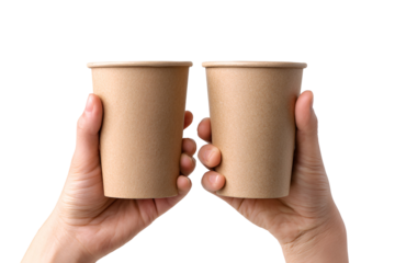 Two hands hold up two brown paper cups