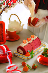 still life roll cake in red and white concept
