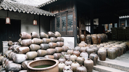 Traditional Chinese Pottery Jars Arranged Outside Old Building