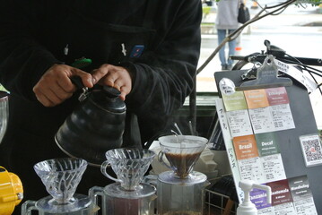 Barista brewing coffee with a hand drip