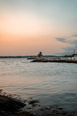 Sunset in Maine, New England over the Atlantic Ocean horizon at the sea shore.