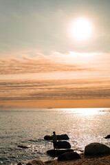 Sunset in Maine, New England over the Atlantic Ocean horizon at the sea shore.