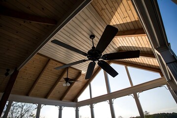 Stunning Worm's-Eye View of a Multi-Bladed Ceiling Fan in a Sunroom with Wood Beams and...