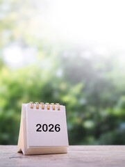Close up 2026 desk calendar on the table with copy space. Resolution, Goal, Action, Planning, and...