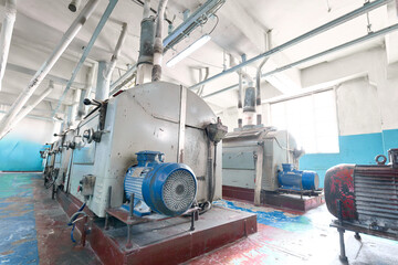 Roller mills in a flour milling facility showcasing large processing machines and industrial...