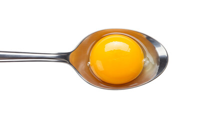 Closeup of a golden egg yolk glistening on a metallic spoon, isolated on white.