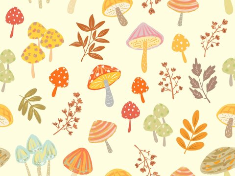 Cute hand-drawn seamless autumn pattern with mushrooms and leaves for fabric and stationary. Autumn motif wallpaper.