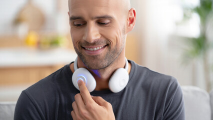 Man using neck vagus nerve stimulator, cervical neuromodulation wearable, heart rate regulation device, emotional regulation tool, autonomic balance technology