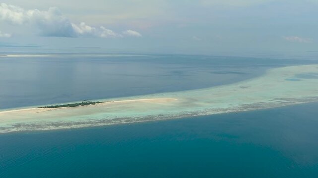 Timba Timba island with beach and coral reef. Tun Sakaran Marine Park. Borneo, Sabah, Malaysia.