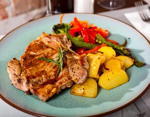 Grilled pork chop with roasted vegetables