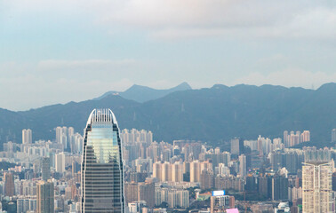 Landscape of scenery aerial view on top of buildings in town Hong Kong. City with white cloudy by...