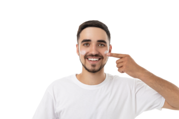 Young man applies moisturizer on his face happily, isolated, PNG
