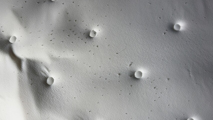 Macro close-up of a white memory foam mattress texture