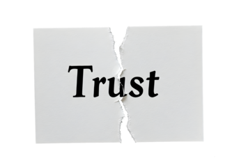 Broken trust concept symbolized by torn paper with bold lettering