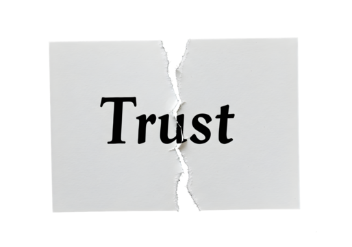 Broken trust concept symbolized by torn paper with bold lettering