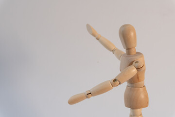 Close-up of a mannequin pointing in two different directions