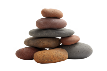 Stacked smooth river stones in earthy tones against black isolated on a transparent background rock pebble