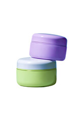 Two round, lidded cosmetic jars, light purple and light lime green, stacked