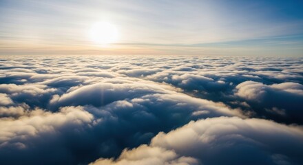 Looking down on a vast sea of fluffy clouds from above, bathed in the warm light of the setting sun