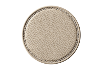 Beige leather coaster, circular, textured.  Stitched edge