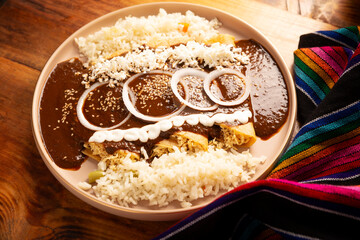Enmoladas. Also known as mole poblano enchiladas, they are a typical Mexican dish that is very popular in Mexico and the rest of the world.