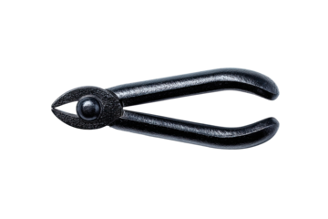 Close-up of dark, black metal snips against black background